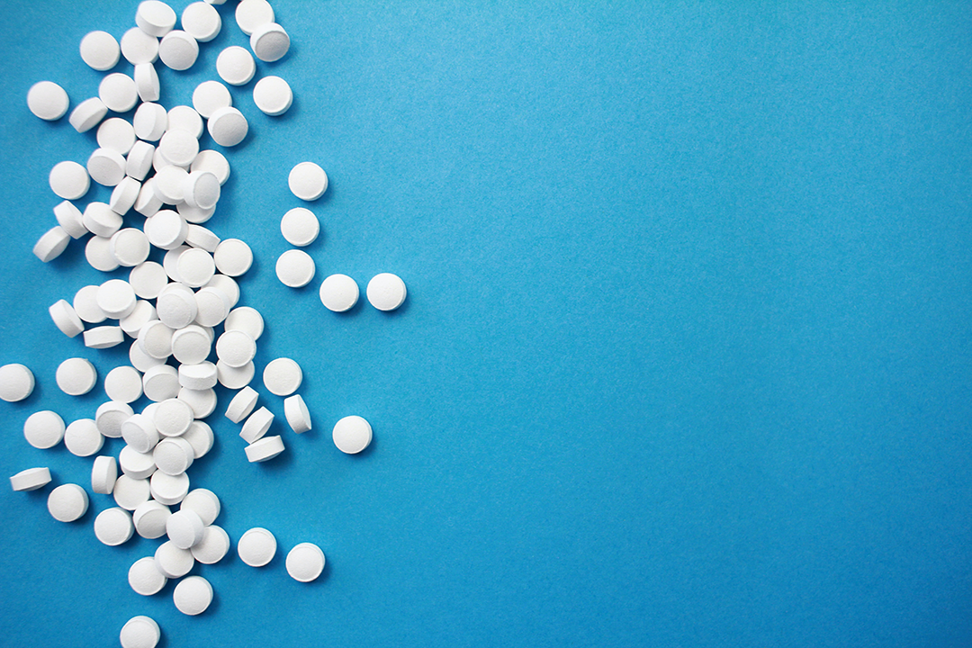 Pills on blue background